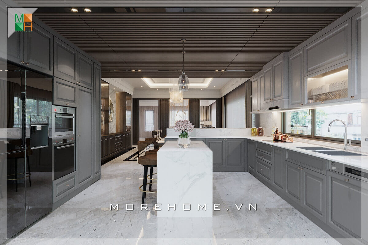 Mẫu thiết kế phòng bếp không gian mở, với hệ thống tủ bếp gỗ kết hợp mặt bàn đá nhân tạo cao cấp với màu trắng - xám, là màu sắc của sự cân bằng, trung tính, mang đến vẻ đẹp sang trọng tinh tế cho không gian phòng bếp Nội thất phòng bếp